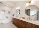 Luxurious bathroom featuring a soaking tub, dual sinks, and contemporary fixtures at 675 Drewry Ne St # 602, Atlanta, GA 30306