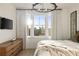 Bedroom showcasing downtown views and a sun-filled interior with simple modern furnishings at 675 Drewry Ne St # 602, Atlanta, GA 30306