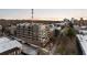 Brick apartment building with balconies and city skyline view on a sunny day at dusk at 675 Drewry Ne St # 602, Atlanta, GA 30306