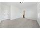 Bedroom with neutral walls, trim, and carpet featuring an adjoining bathroom at 2018 Stonecreek Dr, Woodstock, GA 30188