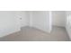 Unfurnished bedroom with neutral carpet, white walls and trim, and a window with blinds at 2018 Stonecreek Dr, Woodstock, GA 30188