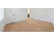 Unfurnished bedroom with hardwood floors, white walls and trim, and a window with blinds at 2018 Stonecreek Dr, Woodstock, GA 30188