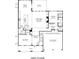 Floor plan of the first floor featuring a flex room, open kitchen, and a two-car garage at 2018 Stonecreek Dr, Woodstock, GA 30188