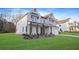 Attractive two-story home with a well-manicured lawn, a brick facade and a covered front porch at 2018 Stonecreek Dr, Woodstock, GA 30188