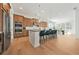 Open kitchen with a large island, breakfast bar, stainless steel appliances, and adjacent dining area at 2018 Stonecreek Dr, Woodstock, GA 30188