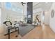 Bright living room with soaring ceilings, a modern fireplace, and large windows at 2018 Stonecreek Dr, Woodstock, GA 30188