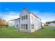 Exterior rear view of a two-story home with white siding and a spacious green lawn at 2018 Stonecreek Dr, Woodstock, GA 30188