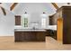 Open kitchen with stainless appliances, large central island, and custom cabinetry at 210 Regester Way, Peachtree City, GA 30269
