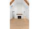 Vaulted ceiling living room featuring fireplace, wood beams, and ample natural light at 210 Regester Way, Peachtree City, GA 30269