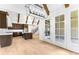 Spacious open concept kitchen and dining area with hardwood floors and stylish design at 210 Regester Way, Peachtree City, GA 30269