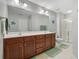 Spacious bathroom featuring double sink vanity, a large mirror, and a glass-enclosed shower at 3966 Covey Flush Sw Ct # 20, Smyrna, GA 30082