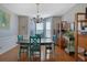 Charming dining area featuring hardwood floors and a rustic-style table with decorative chandelier at 3966 Covey Flush Sw Ct # 20, Smyrna, GA 30082