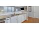 Kitchen with double sink, stainless steel appliances, white cabinets and an open layout at 3966 Covey Flush Sw Ct # 20, Smyrna, GA 30082