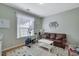Cozy living space with a leather sofa, exercise bike, and a light, neutral color palette at 3966 Covey Flush Sw Ct # 20, Smyrna, GA 30082
