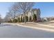 Scenic street showcasing well-kept townhomes with lush greenery and curb appeal at 3966 Covey Flush Sw Ct # 20, Smyrna, GA 30082