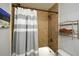 Bathroom featuring a tiled shower with a grey and white striped shower curtain at 125 N River Dr # F, Atlanta, GA 30350