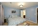 Spacious bedroom with blue walls, carpet flooring, and ample natural light at 125 N River Dr # F, Atlanta, GA 30350