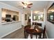 Cozy dining room features a ceiling fan and a view into the adjacent kitchen and living area at 125 N River Dr # F, Atlanta, GA 30350