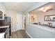 This kitchen has stainless steel appliances, white cabinets, and a view into the dining area at 125 N River Dr # F, Atlanta, GA 30350
