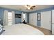 Well-lit main bedroom features plush carpet, ceiling fan, and double closets for ample storage at 125 N River Dr # F, Atlanta, GA 30350