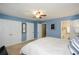 A great view of the main bedroom including closet space, ensuite bathroom, and carpet flooring at 125 N River Dr # F, Atlanta, GA 30350