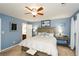 Spacious main bedroom offers a ceiling fan, ensuite bathroom, and multiple windows at 125 N River Dr # F, Atlanta, GA 30350