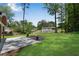 Spacious backyard featuring a fire pit, mature trees, and a lush lawn at 4770 Wayland Cir, Acworth, GA 30101
