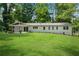 Spacious backyard with a well-maintained lawn, offering plenty of room for outdoor activities and enjoyment at 4770 Wayland Cir, Acworth, GA 30101