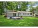 Charming backyard with a fire pit, patio, and lush green lawn, ideal for outdoor relaxation and entertaining at 4770 Wayland Cir, Acworth, GA 30101