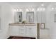 Bright bathroom featuring a double vanity with granite countertops, modern fixtures, and a spacious shower at 4770 Wayland Cir, Acworth, GA 30101