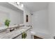 Bathroom with granite countertops, a white shower-tub combo, and wood-look flooring at 4770 Wayland Cir, Acworth, GA 30101