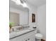 Bathroom featuring granite countertops, a sleek mirror, and modern fixtures at 4770 Wayland Cir, Acworth, GA 30101