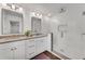 The bright bathroom features a double vanity with granite countertops and a subway-tiled shower at 4770 Wayland Cir, Acworth, GA 30101