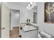 Bathroom featuring granite countertops, white cabinets and modern fixtures at 4770 Wayland Cir, Acworth, GA 30101