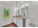 The bright bathroom features a double vanity with granite countertops and a subway-tiled shower at 4770 Wayland Cir, Acworth, GA 30101