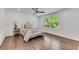 Spacious bedroom features hardwood floors, a ceiling fan, and large windows that fill the room with natural light at 4770 Wayland Cir, Acworth, GA 30101