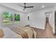 Bright, spacious bedroom features hardwood floors, a ceiling fan, and large windows offering backyard views at 4770 Wayland Cir, Acworth, GA 30101