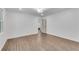 Bedroom with hardwood floors, white walls and access to the ensuite at 4770 Wayland Cir, Acworth, GA 30101