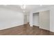 Bedroom with hardwood floors, white walls, closet, and access to the ensuite at 4770 Wayland Cir, Acworth, GA 30101