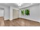 Bright bedroom featuring hardwood floors, a window offering outdoor views and closet with panel doors at 4770 Wayland Cir, Acworth, GA 30101