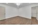 Bedroom with hardwood floors, white walls and access to a walk-in closet at 4770 Wayland Cir, Acworth, GA 30101