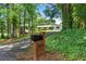 Secluded home on a wooded lot; note the long driveway and lush foliage creating privacy at 4770 Wayland Cir, Acworth, GA 30101