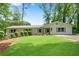 Charming one-story home featuring a lush lawn, freshly painted brick, and a welcoming front entrance at 4770 Wayland Cir, Acworth, GA 30101