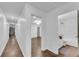 The hallway features hardwood floors and leads to a full bathroom and other rooms in the house at 4770 Wayland Cir, Acworth, GA 30101