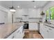 Bright kitchen featuring granite countertops, white cabinets and stainless steel appliances at 4770 Wayland Cir, Acworth, GA 30101