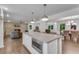 Open concept kitchen featuring a central island and seamless flow into the living and dining areas at 4770 Wayland Cir, Acworth, GA 30101