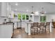 Bright kitchen with white cabinets, granite countertops, island with seating, and stainless steel appliances at 4770 Wayland Cir, Acworth, GA 30101