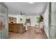 Open-concept living area with fireplace and view to hardwood floors and natural light from large window at 4770 Wayland Cir, Acworth, GA 30101