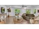 Bright living room with hardwood floors, neutral paint, and large windows showcasing the outdoor view at 4770 Wayland Cir, Acworth, GA 30101