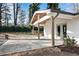 Back patio with a ceiling fan, wooden pillars, and a landscaped yard at 4770 Wayland Cir, Acworth, GA 30101